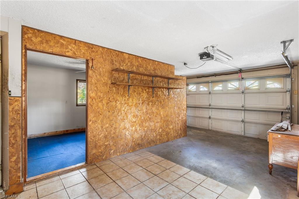 465 5th Street Southwest Naples, FL 34117 - Photo 26 of 33 Garage with a garage door opener