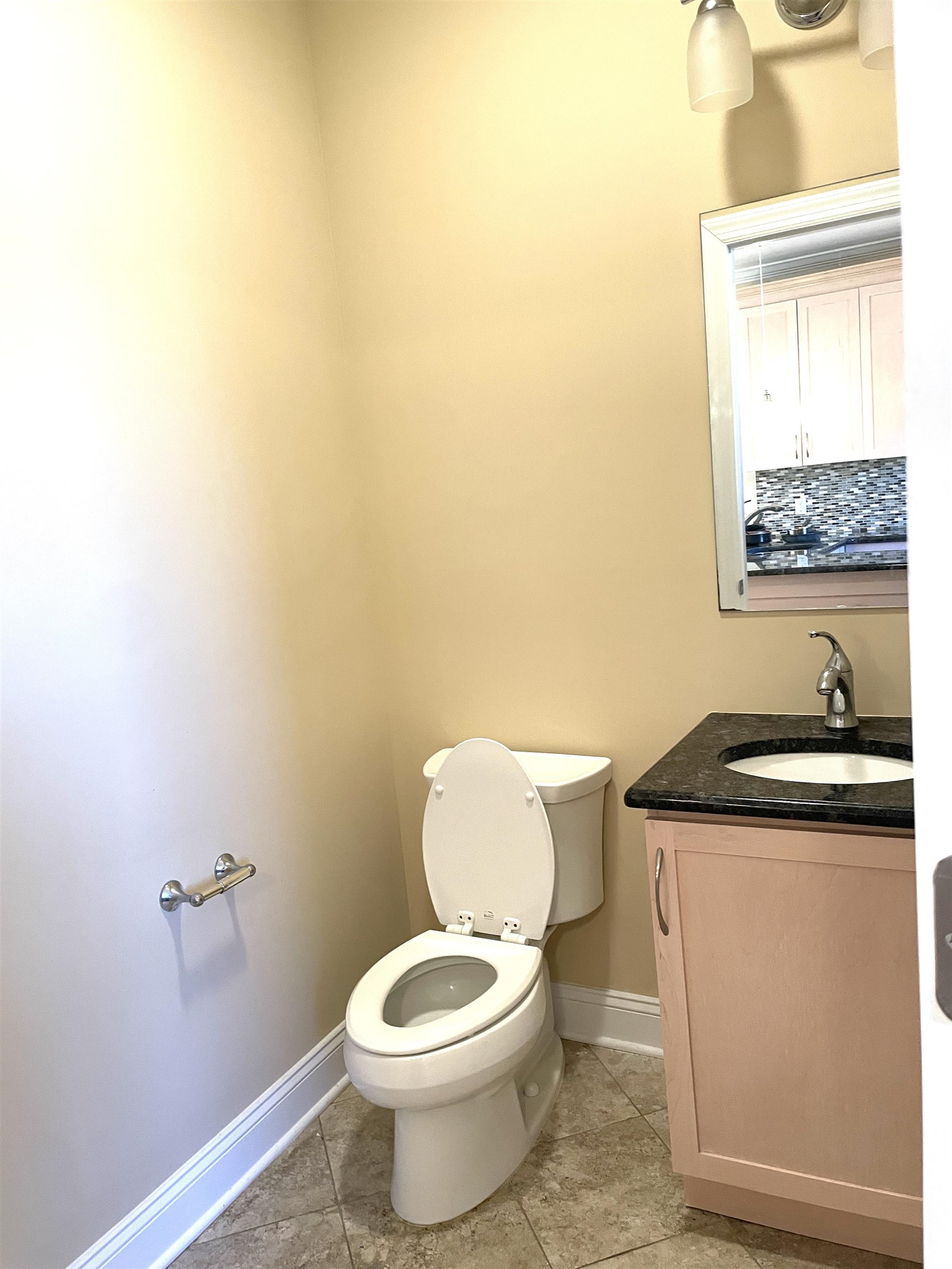 734 County Avenue, Unit B2 Secaucus, NJ 07094 - Photo 12 of 19 a bathroom with a granite countertop toilet and a sink