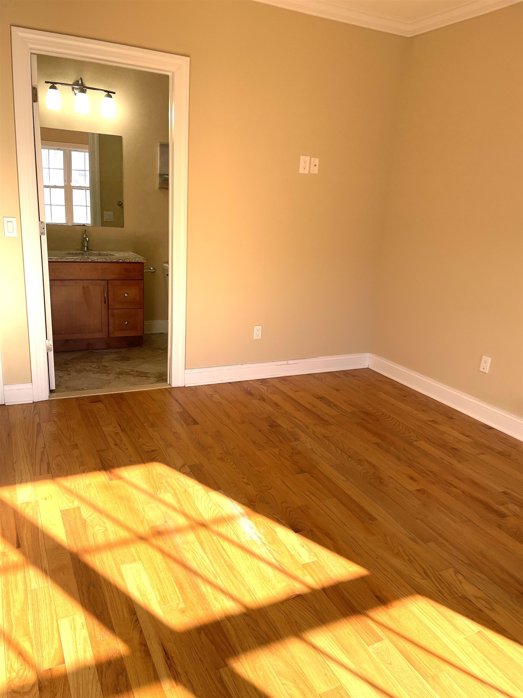 734 County Avenue, Unit B2 Secaucus, NJ 07094 - Photo 14 of 19 a view of an empty room with wooden floor and a sink