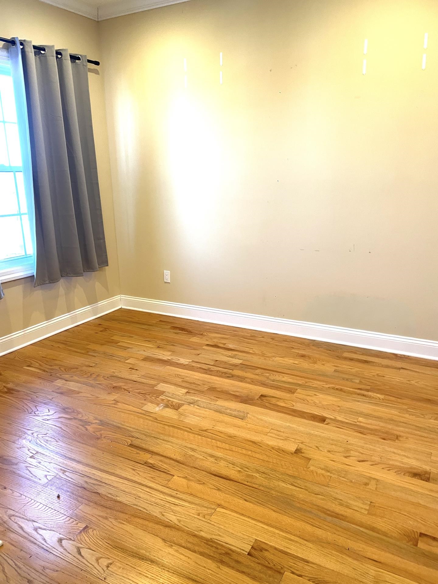 734 County Avenue, Unit B2 Secaucus, NJ 07094 - Photo 18 of 19 a view of an empty room with wooden floor and a window