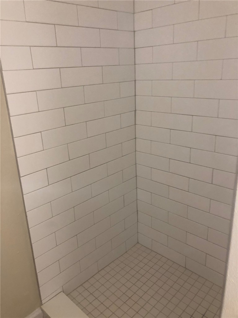4306 Avenue A, Unit 109 Austin, TX 78751 - Photo 8 of 13 a bathroom with a white shower
