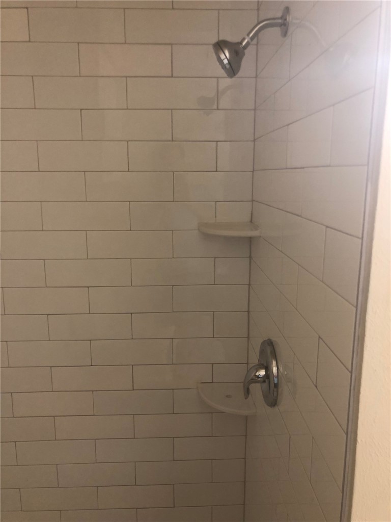4306 Avenue A, Unit 109 Austin, TX 78751 - Photo 9 of 13 a bathroom with a shower