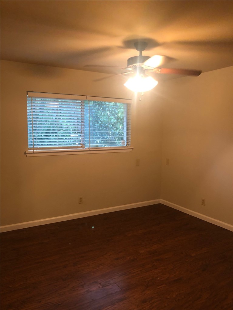 4306 Avenue A, Unit 109 Austin, TX 78751 - Photo 10 of 13 a view of a small space with wooden floor and a window