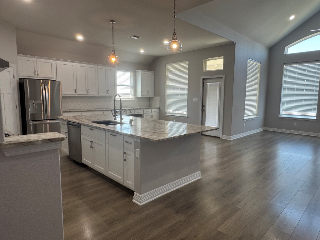 812 Karst Cove Georgetown, TX 78628 - Photo 15 of 40 a kitchen with a sink stainless steel appliances and cabinets