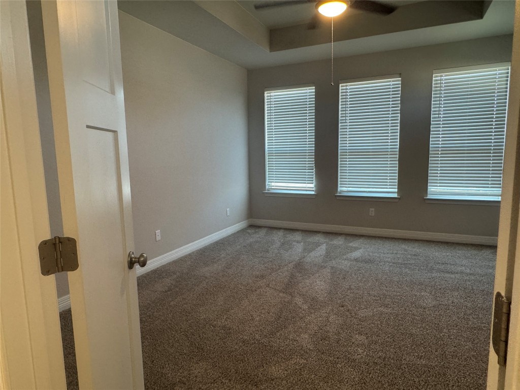 812 Karst Cove Georgetown, TX 78628 - Photo 32 of 40 a view of an empty room with a window