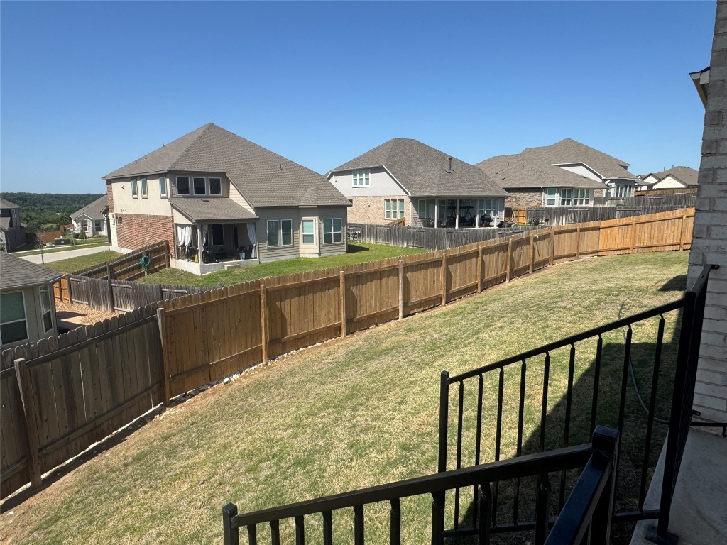 812 Karst Cove Georgetown, TX 78628 - Photo 37 of 40 a view of a house with wooden deck and city view