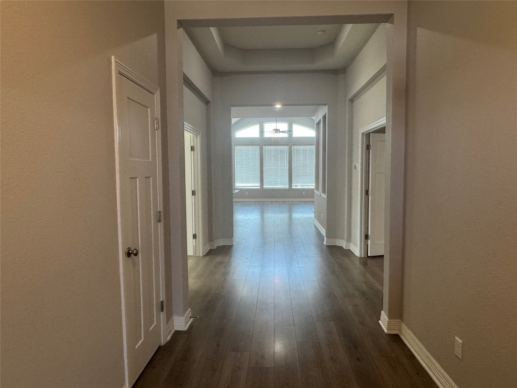 812 Karst Cove Georgetown, TX 78628 - Photo 6 of 40 an empty room with wooden floor and a window
