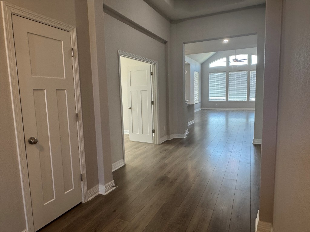 812 Karst Cove Georgetown, TX 78628 - Photo 8 of 40 a view of a hallway with wooden floor