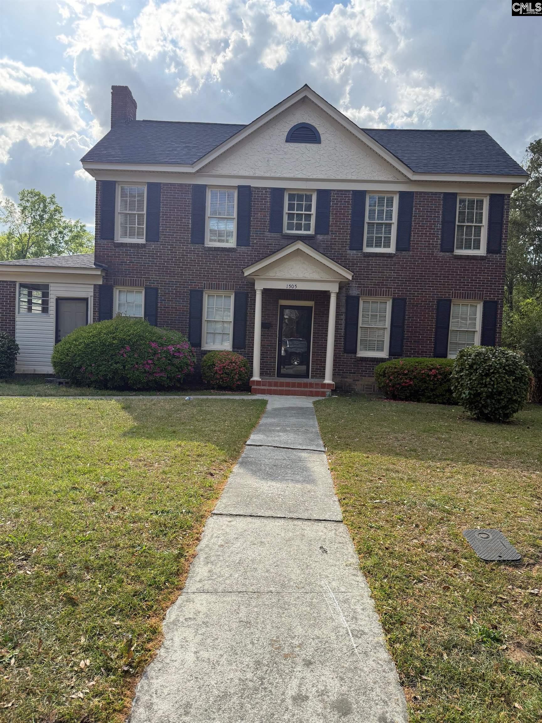 1505 Maple Street Columbia, SC 29205 - Photo 1 of 1 a front view of a house with garden