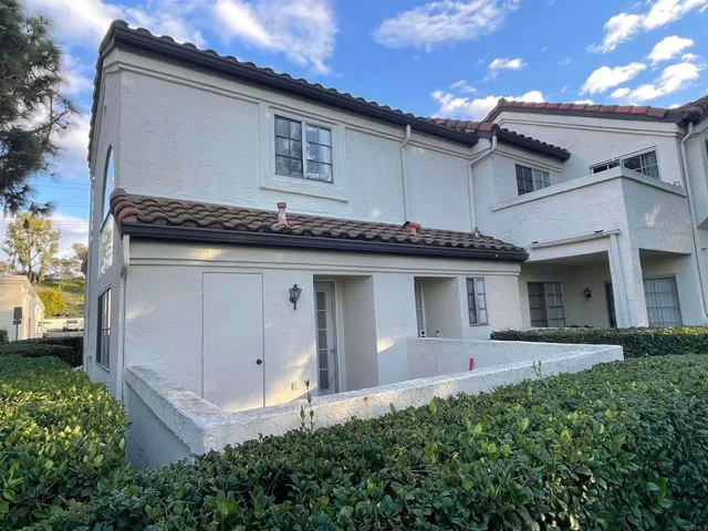 a front view of a house with a garage