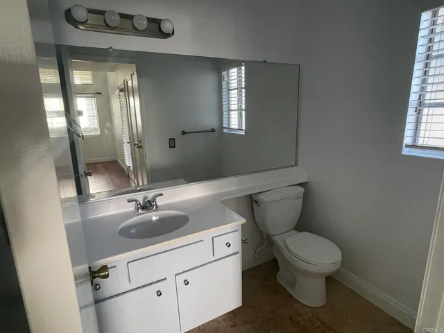 a kitchen with a sink a stove and a microwave oven