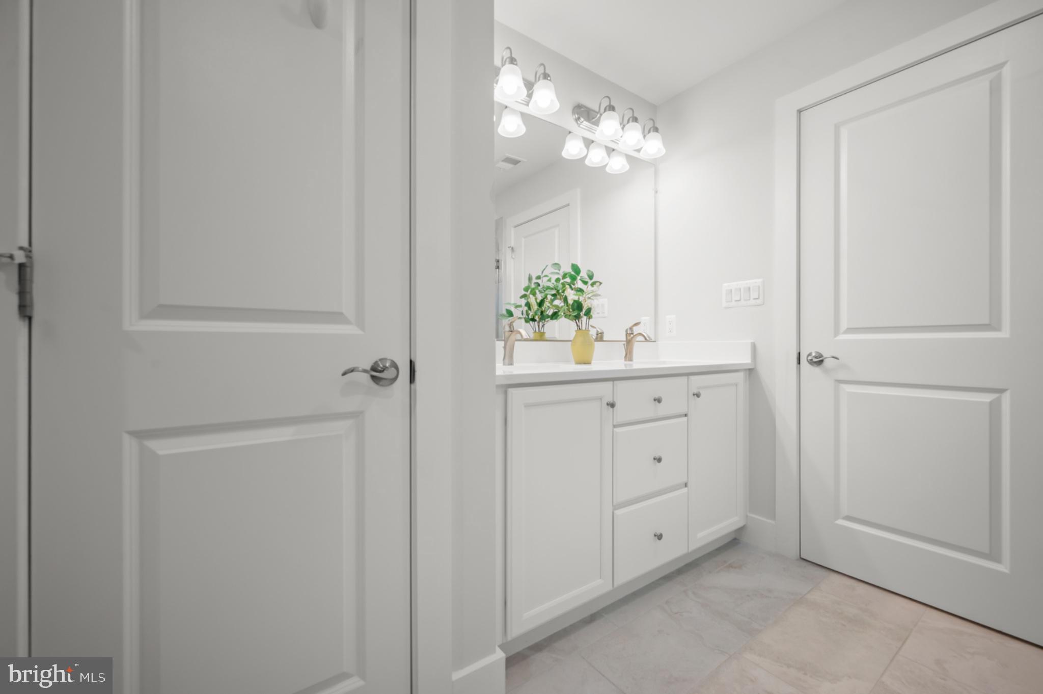 8702 Southrun Road Lorton, VA 22079 - Photo 23 of 35 Dual vanity in primary en-suite bathroom