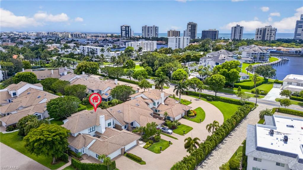 4030 Crayton Road, Unit C2 Naples, FL 34103 - Photo 4 of 32 a city view with tall buildings