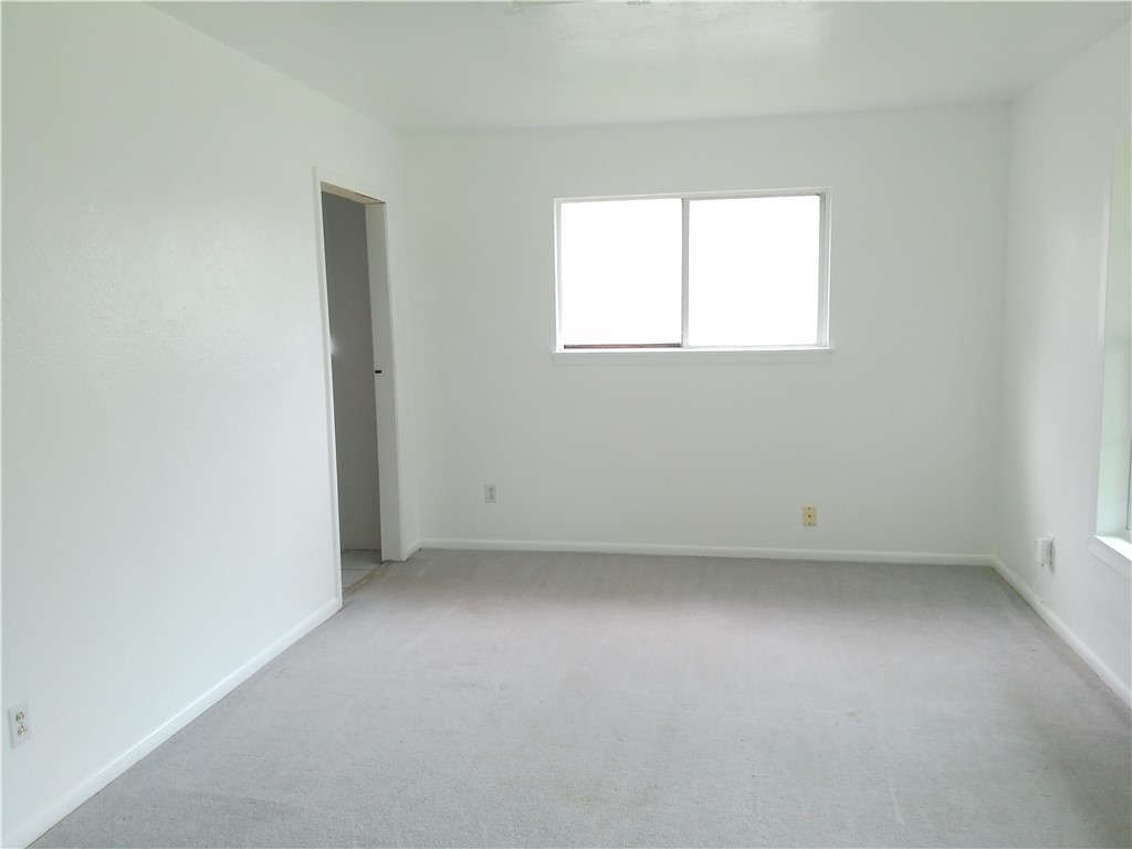 4117 Monaco Street Corpus Christi, TX 78411 - Photo 2 of 17 an empty room with a window