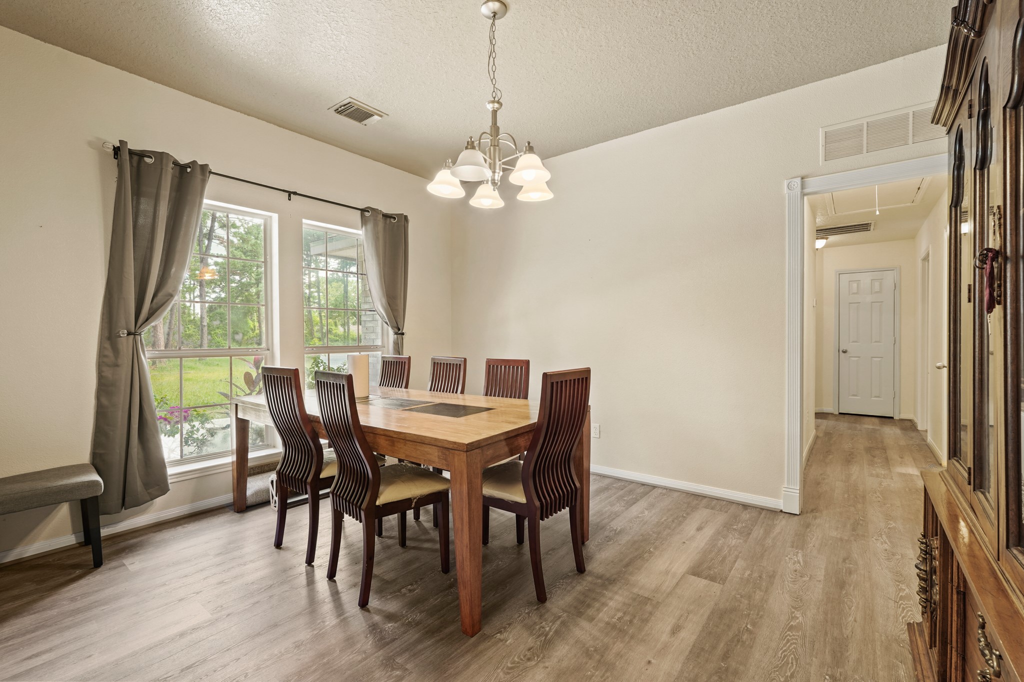 14616 Grant Road Cypress, TX 77429 - Photo 6 of 18 a view of a dining room with furniture window and wooden floor