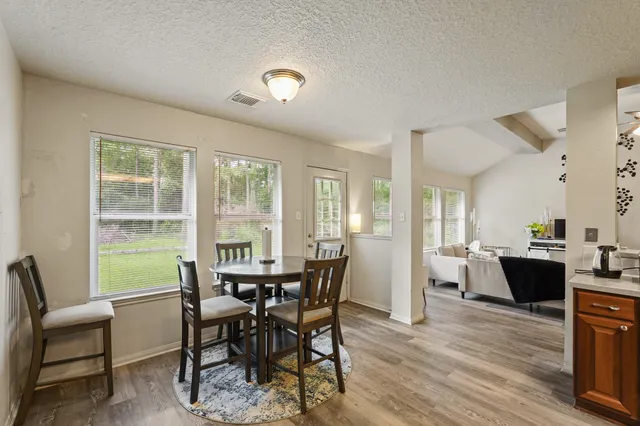 a bedroom with furniture and a window