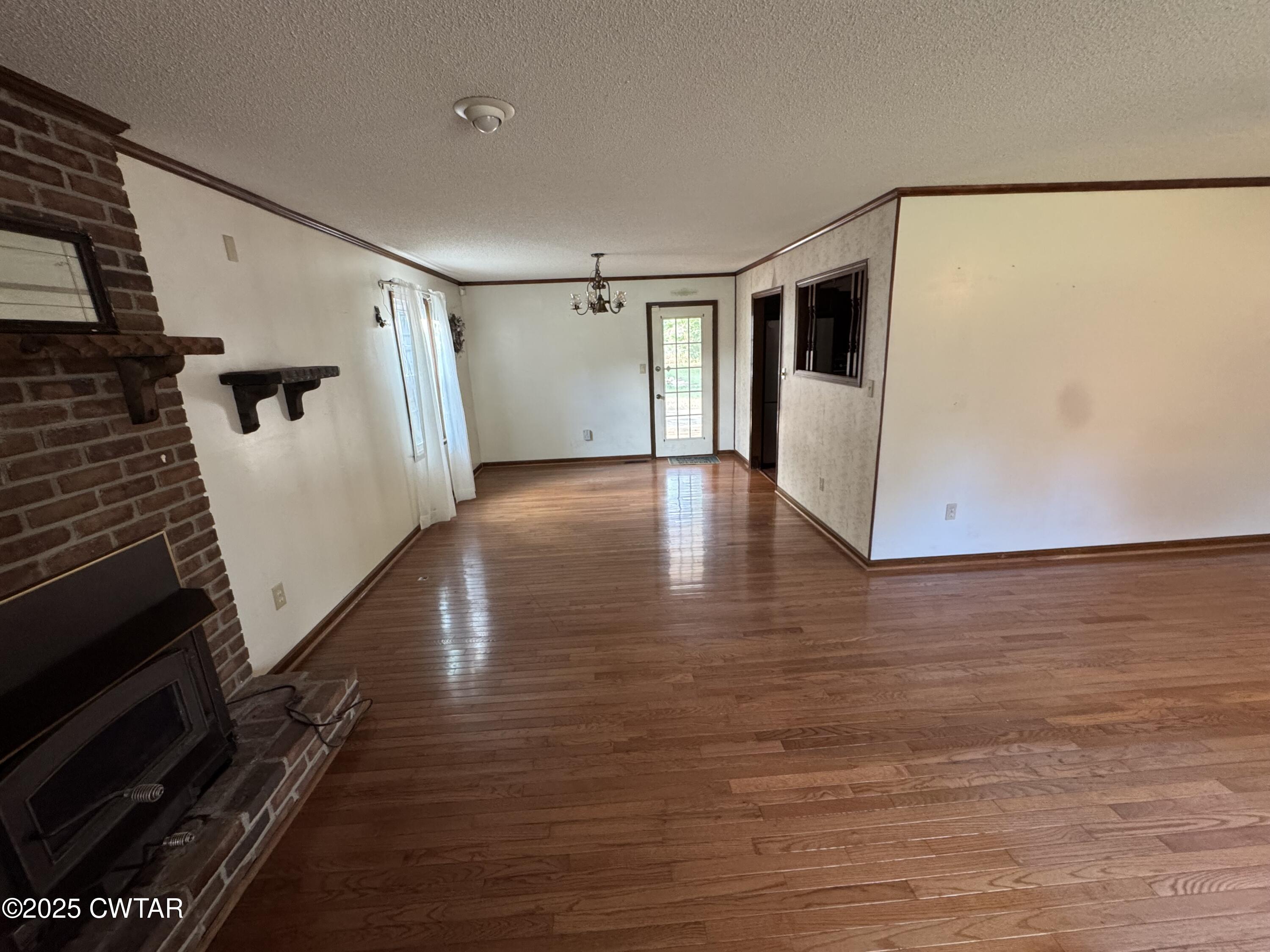 274 Fox Ridge Road Jackson, TN 38305 - Photo 2 of 16 a view of a hallway with wooden floor and cabinets