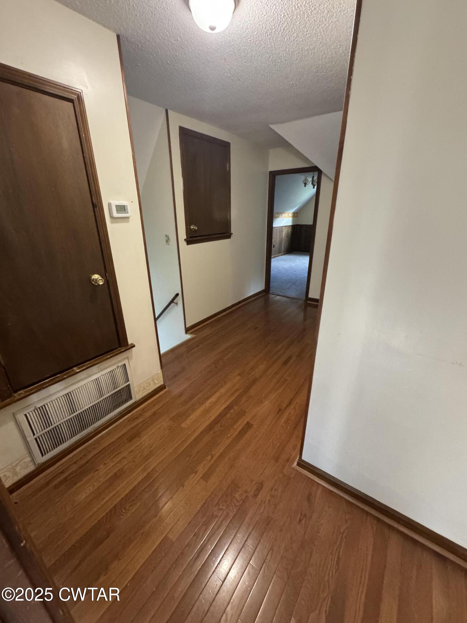 274 Fox Ridge Road Jackson, TN 38305 - Photo 10 of 16 a view of a hallway with wooden floor