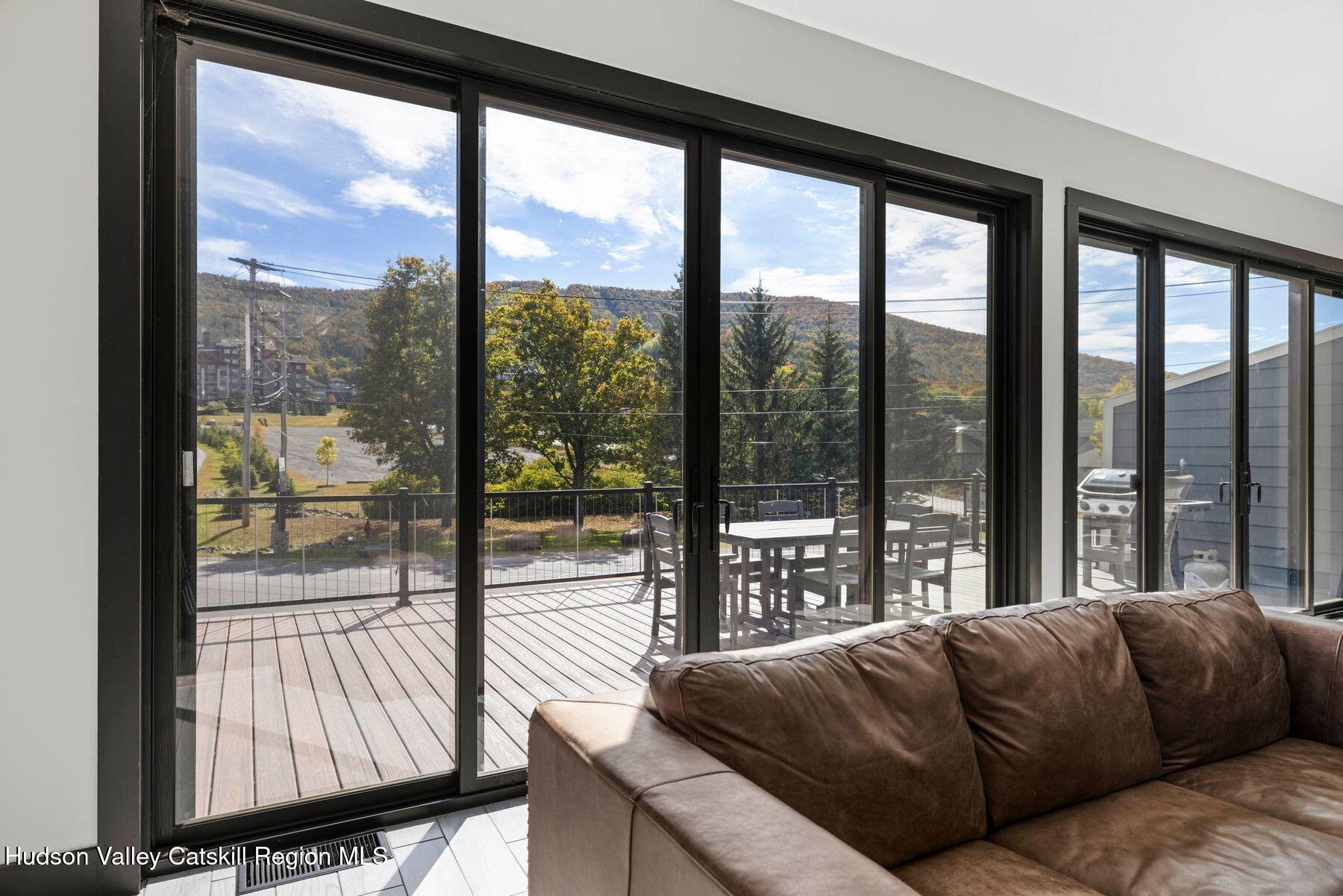 3 South Street Windham, NY 12496 - Photo 11 of 61 a living room with couch and a large window