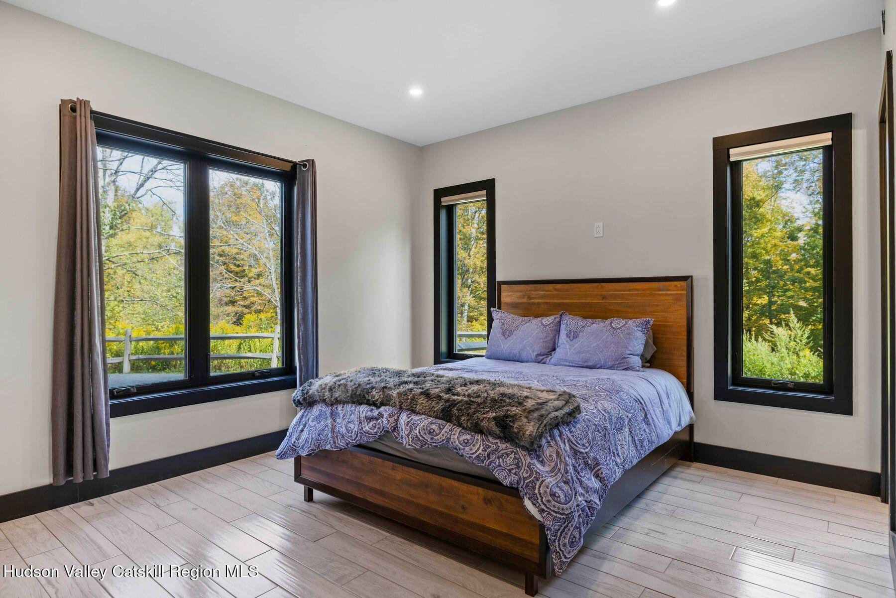 3 South Street Windham, NY 12496 - Photo 22 of 61 a bedroom with a large bed and a window