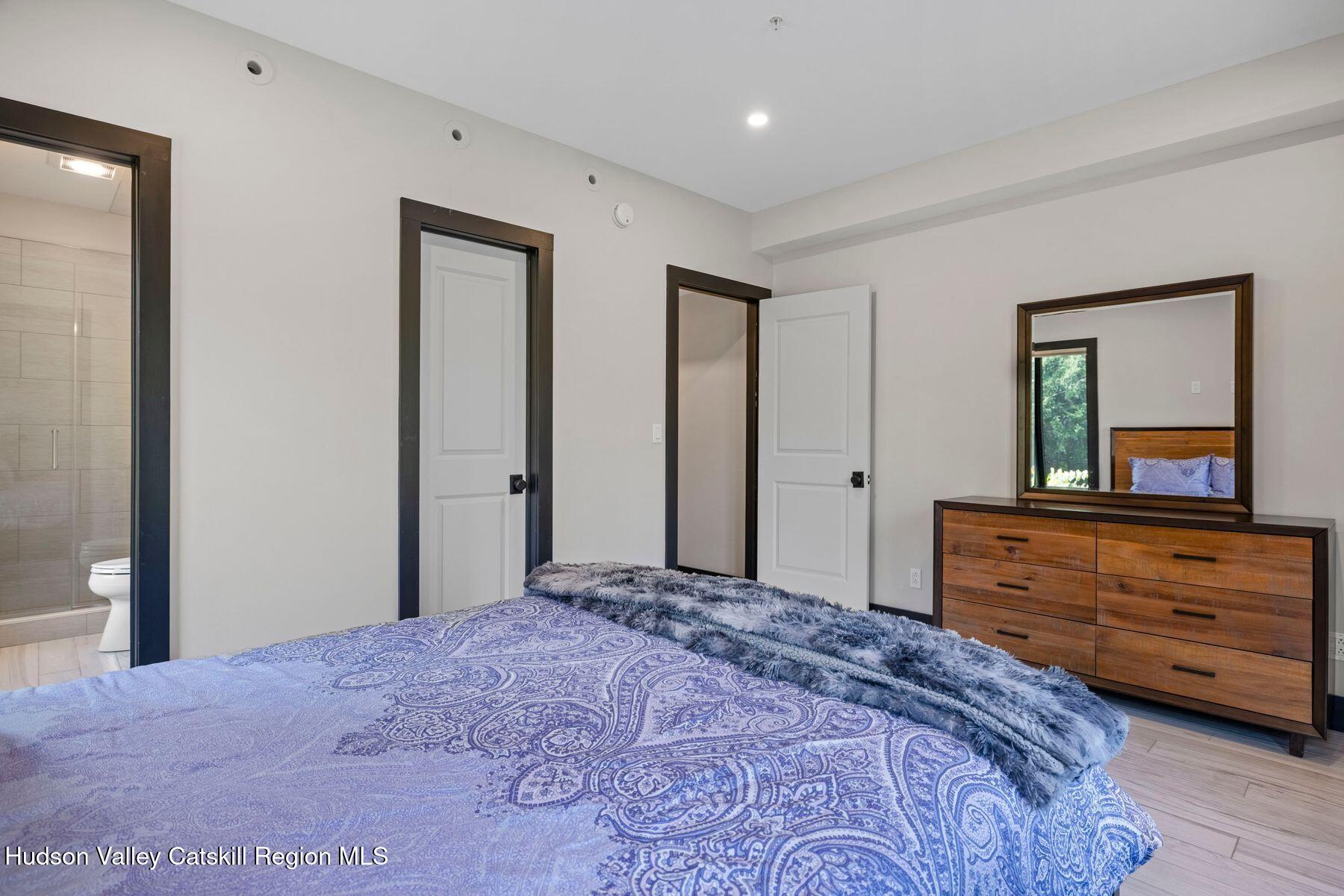 3 South Street Windham, NY 12496 - Photo 23 of 61 a bedroom with a bed and a dresser