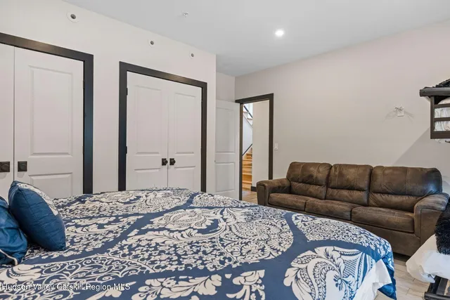 a bedroom with a bed and a dresser