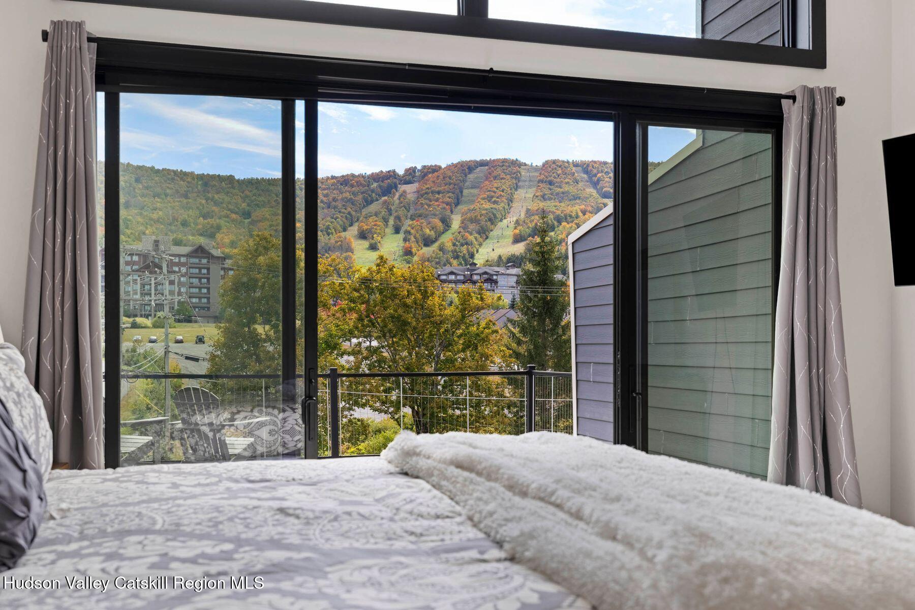 3 South Street Windham, NY 12496 - Photo 33 of 61 a bedroom with a bed and a large window
