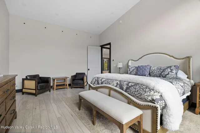 a bathroom with a granite countertop sink a toilet and shower
