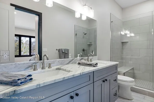 a view of a chair and tables in the balcony