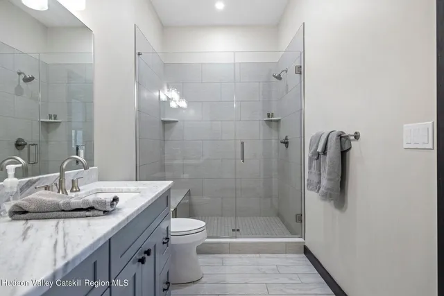 a view of balcony with furniture and wooden floor