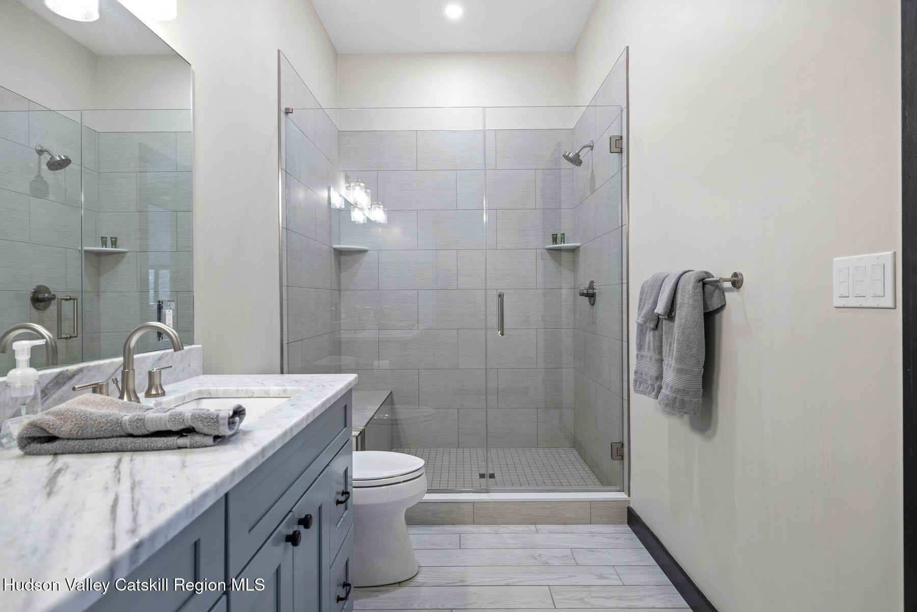 3 South Street Windham, NY 12496 - Photo 45 of 61 a bathroom with a sink a toilet and shower