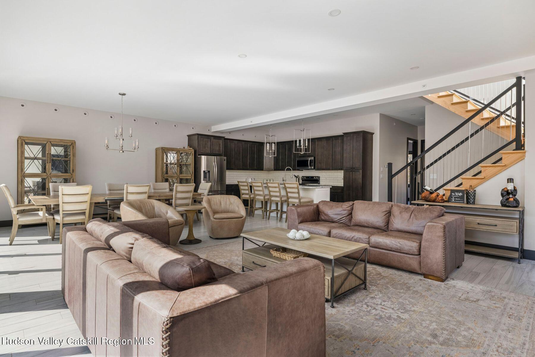 3 South Street Windham, NY 12496 - Photo 9 of 61 a living room with furniture kitchen view and a wooden floor