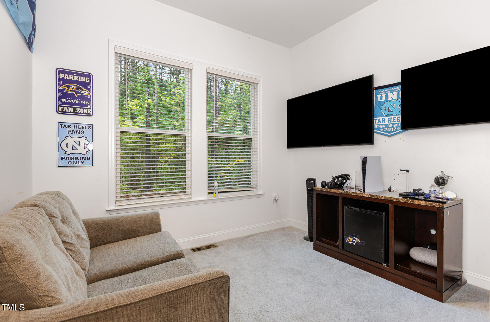 25 Cackling Way Zebulon, NC 27597 - Photo 17 of 32 a living room with furniture and a flat screen tv