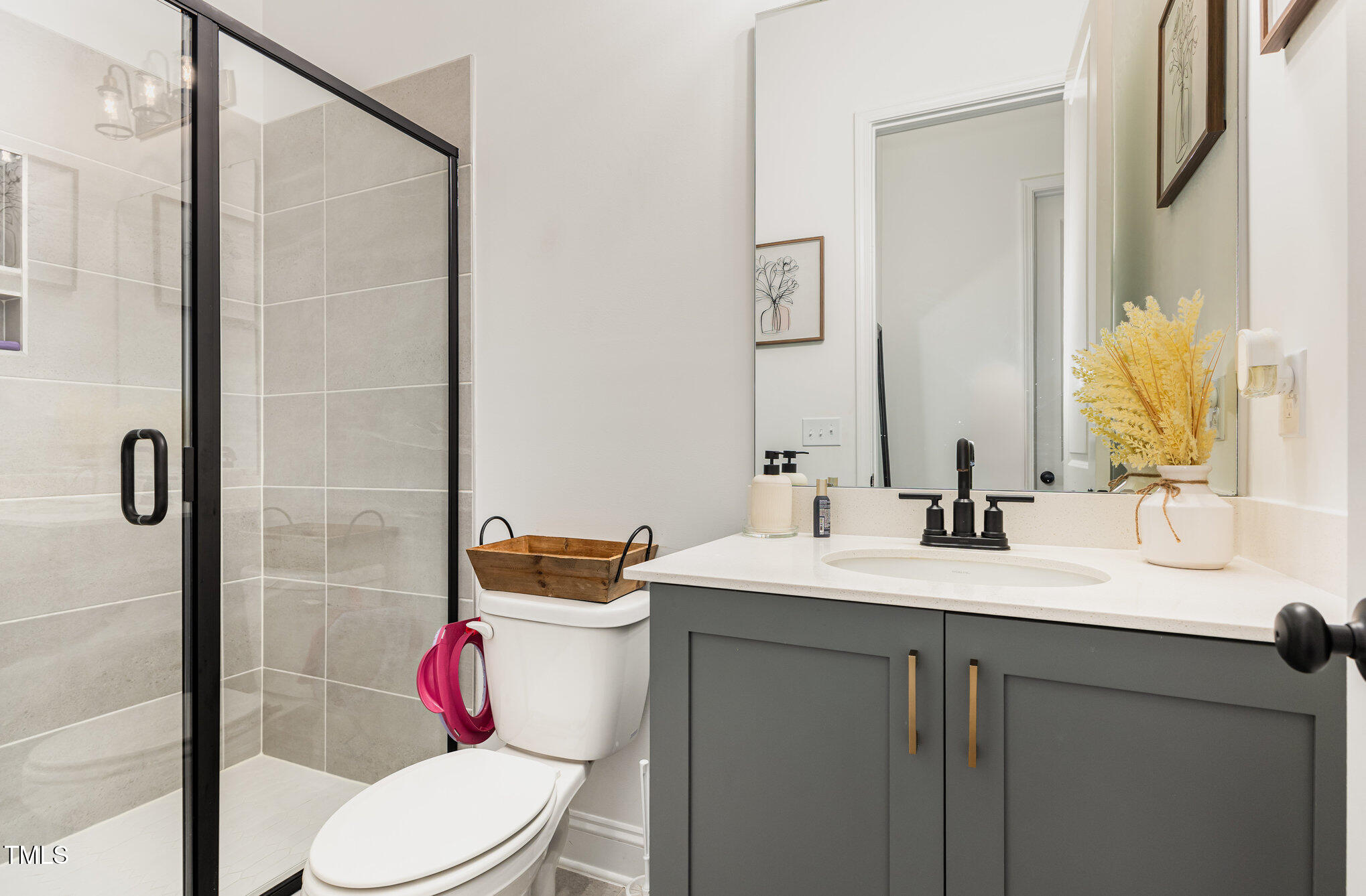 25 Cackling Way Zebulon, NC 27597 - Photo 18 of 32 a bathroom with a sink toilet and shower