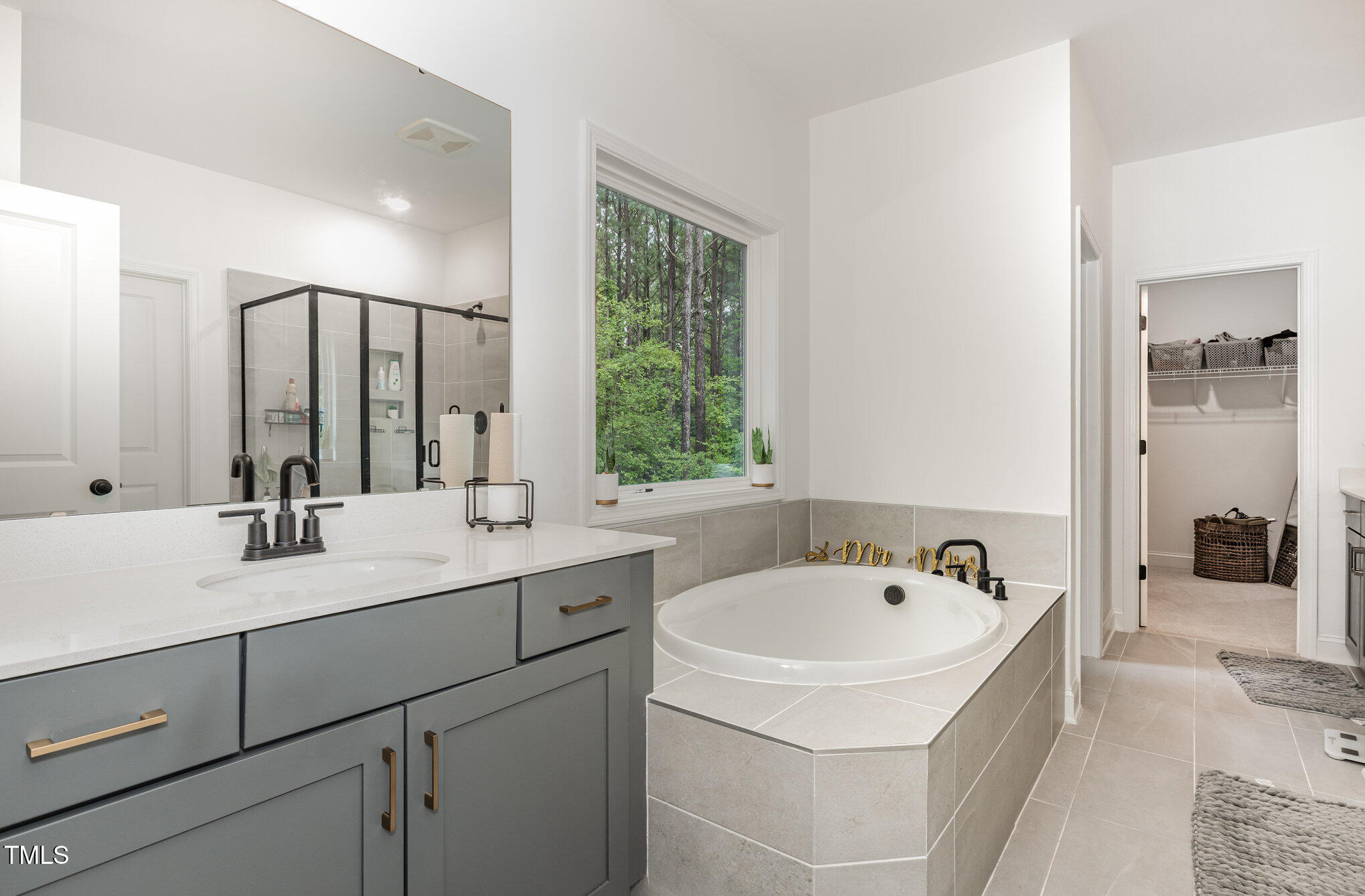 25 Cackling Way Zebulon, NC 27597 - Photo 21 of 32 a bathroom with a sink and a bathtub