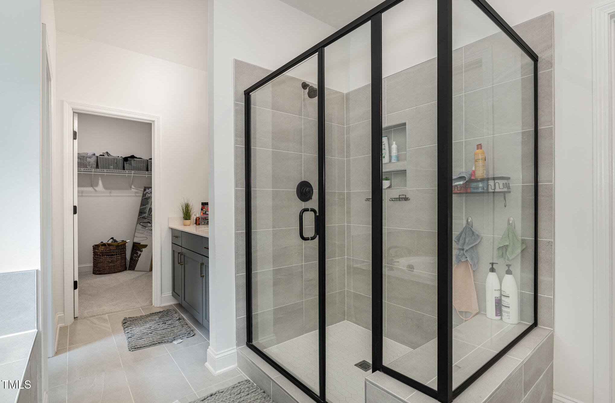 25 Cackling Way Zebulon, NC 27597 - Photo 22 of 32 a bathroom with a shower and a sink