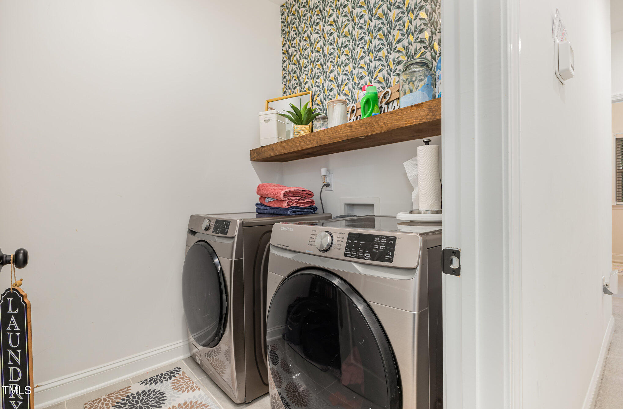 25 Cackling Way Zebulon, NC 27597 - Photo 23 of 32 a view of washer and dryer in a utility room