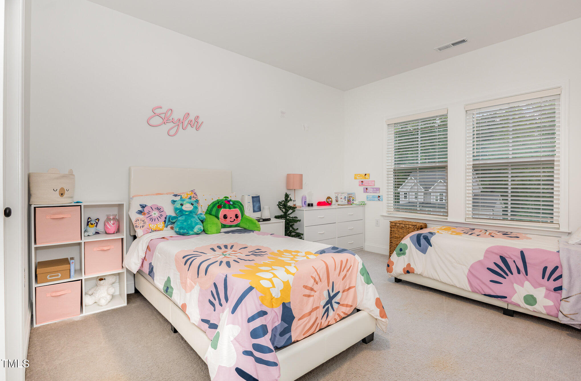 25 Cackling Way Zebulon, NC 27597 - Photo 27 of 32 a bedroom with a bed and a book shelf