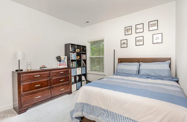 a bedroom with a bed and a cabinets