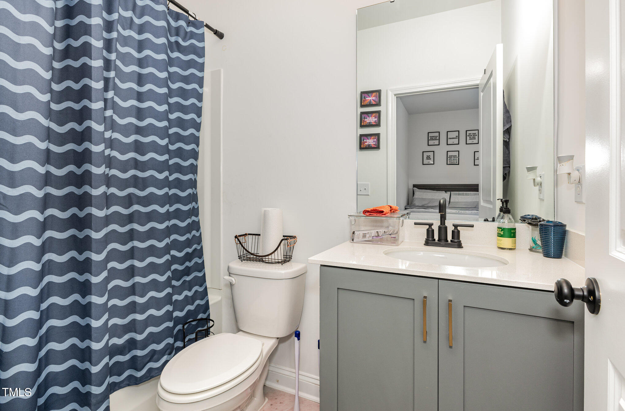 25 Cackling Way Zebulon, NC 27597 - Photo 29 of 32 a white toilet sitting next to a bathroom sink