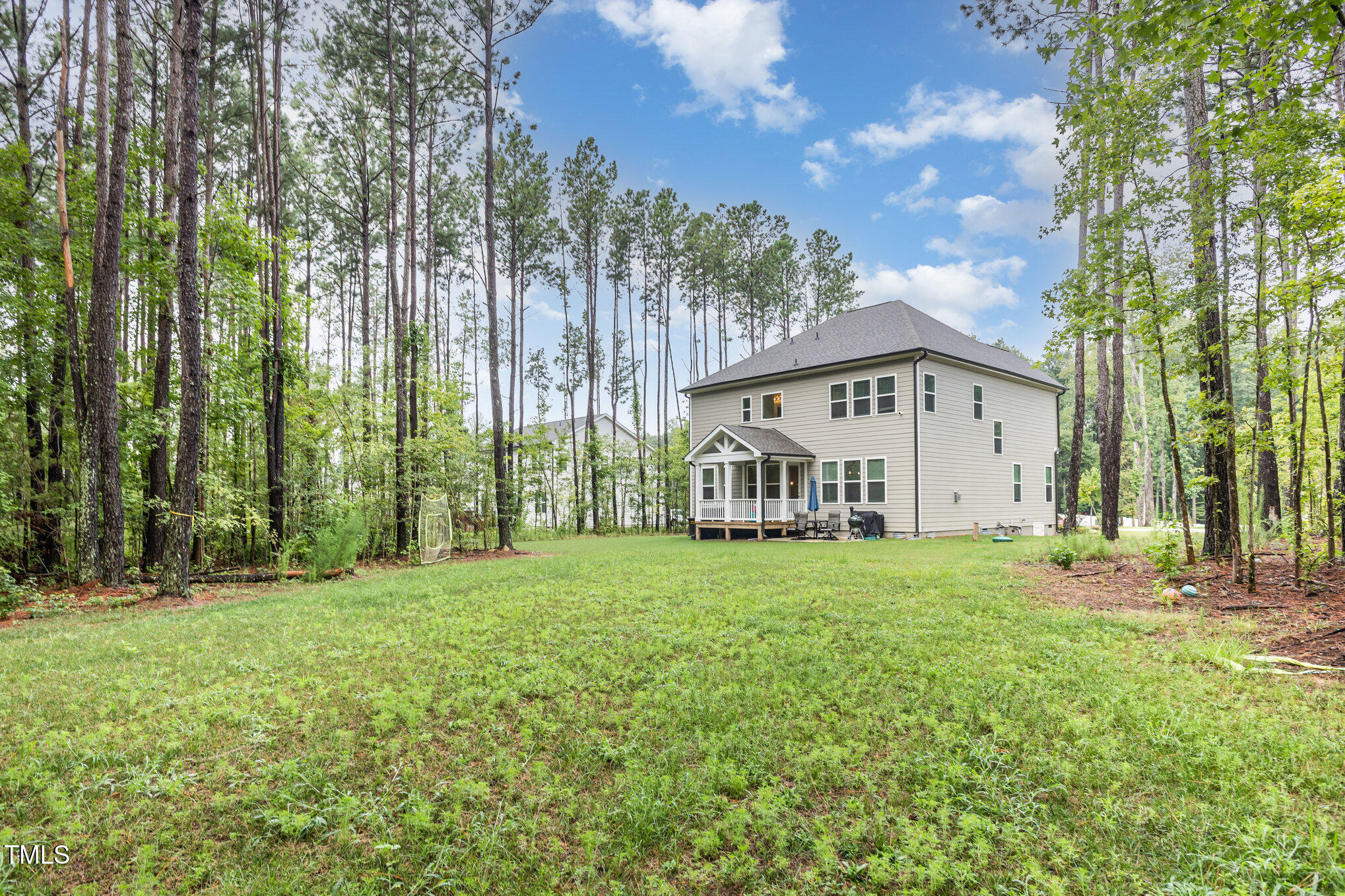 25 Cackling Way Zebulon, NC 27597 - Photo 5 of 32 a view of a house with backyard and garden