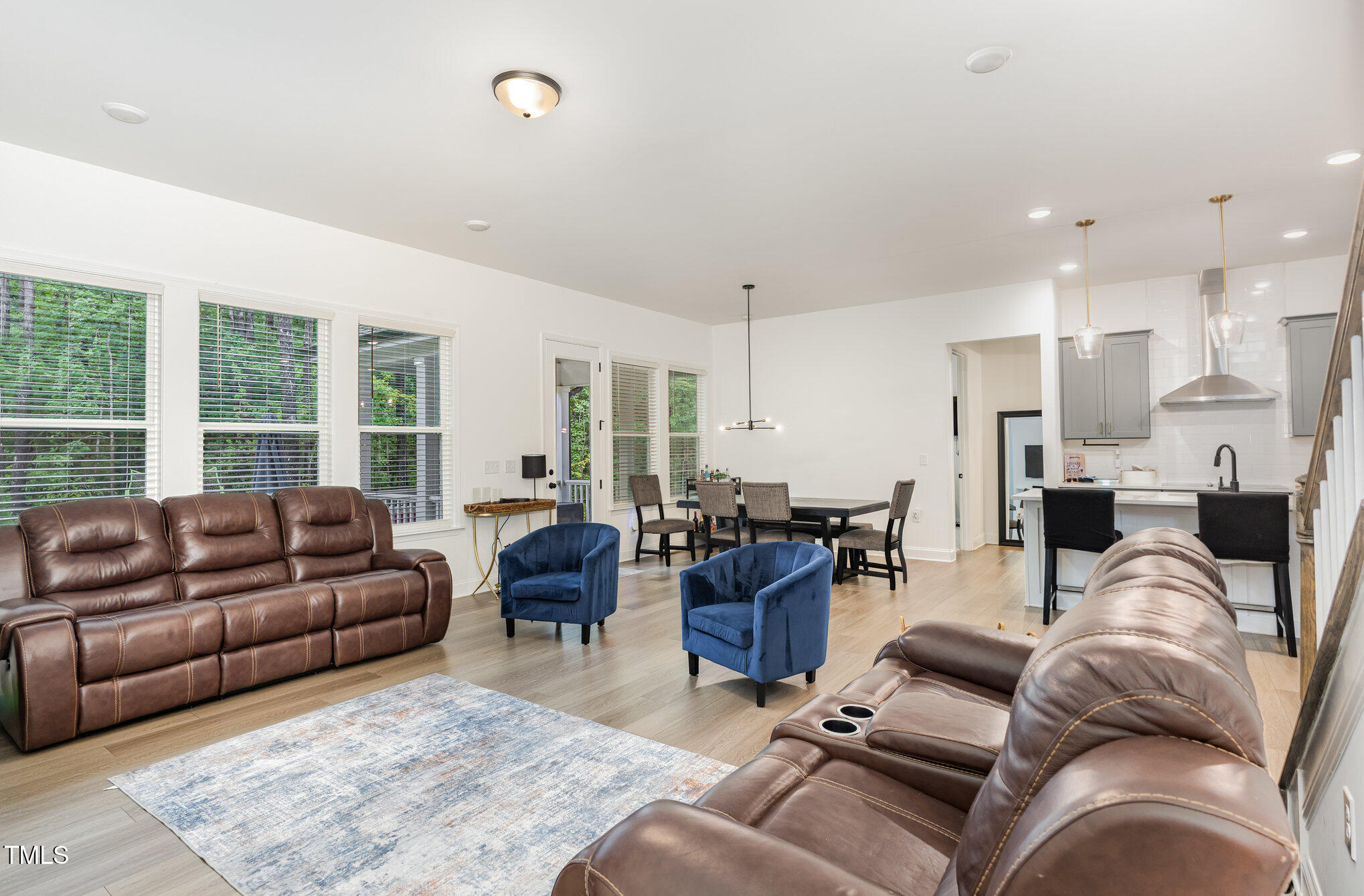 25 Cackling Way Zebulon, NC 27597 - Photo 9 of 32 a living room with furniture kitchen view and a large window