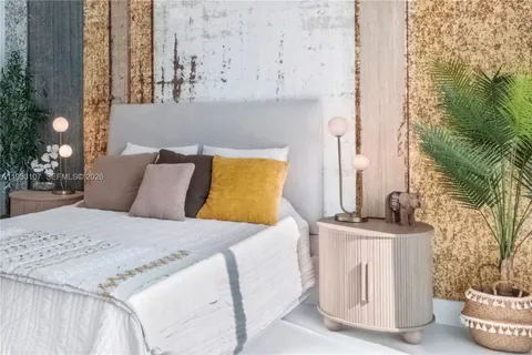 a bedroom with a bed and a couch