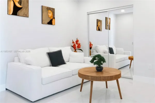 a living room with furniture and a table
