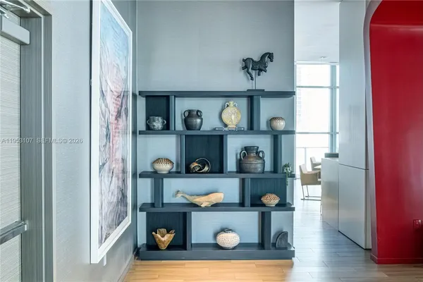 a living room with furniture and a book shelf