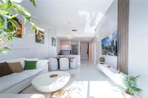 a living room with furniture and a table
