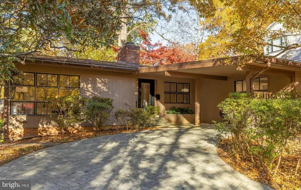 a house with trees in front of it