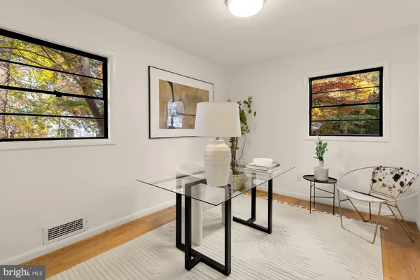 a view of a livingroom with furniture and wooden floor