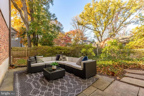 a view of a patio with couches and potted plants