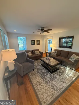 a living room with furniture and a rug